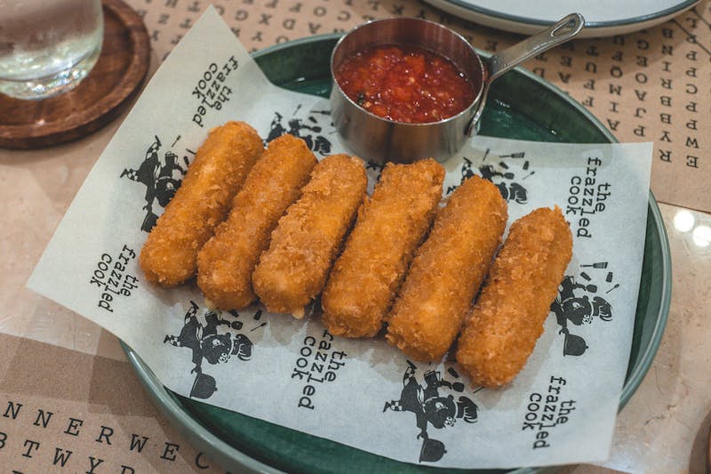 Crispy mozzarella sticks served with marinara at Anthony's