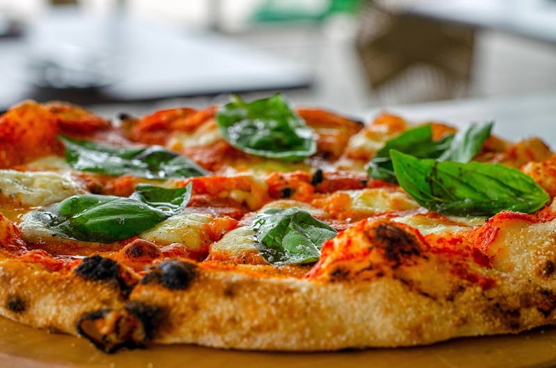 Coal fired clam pizza with roasted garlic and olive oil